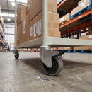 75mm braked grey rubber castor fitted to a warehouse trolley