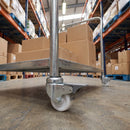 75mm braked white nylon castor fitted to a warehouse trolley