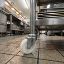 75mm white nylon swivel castor fitted to a catering trolley
