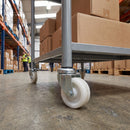 75mm white nylon swivel castor fitted to a warehouse trolley