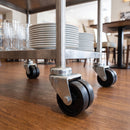 75mm black twin wheel bolt hole swivel castors on a hotel serving trolley