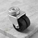 75mm twin wheel swivel bolt hole castor black rubber on polypropylene wheels 90kg on grey marble