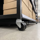 75mm twin wheel swivel bolt hole castor with black wheels fitted to a shop display unit tube leg
