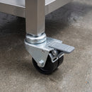 75mm twin wheel total lock bolt hole castor with grey foot brake fitted to a stainless steel kitchen table leg