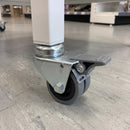 75mm twin wheel total lock bolt hole castor with grey rubber wheels fitted to a white shop display unit leg