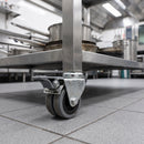 75mm twin wheel braked grey rubber bolt hole castor fitted under the square leg of a stainless steel catering prep table