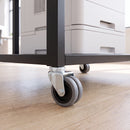 75mm grey rubber twin wheel swivel castor with M10 bolt hole on an office equipment cart