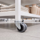 75mm twin wheel grey rubber bolt hole castor fitted to a retail shop display unit tube leg