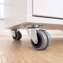 75mm twin wheel grey rubber top plate swivel castors bolted under a white office storage cabinet