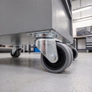 75mm grey rubber twin wheel top plate castor bolted to a mobile tool cabinet in a workshop