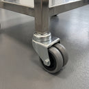 75mm twin wheel bolt hole castor with grey rubber wheels fitted to a stainless steel laboratory trolley leg