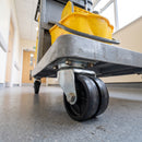 75mm twin wheel top plate castor fitted under a commercial cleaning cart with mop bucket