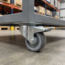 80mm braked swivel castor with grey polyurethane wheel under a steel equipment rack trolley
