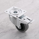 80mm braked swivel top plate castor grey rubber wheel 100kg, high angle view on grey marble