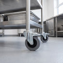80mm braked grey rubber bolt hole castor fitted to a stainless steel utility cart leg