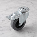 80mm braked swivel castor with grey rubber on polypropylene wheel, top view of the 12mm bolt hole and foot brake