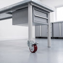 80mm braked red polyurethane castor on a grey steel mobile workbench