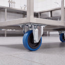 80mm fixed top plate castor with blue non-marking rubber wheel under a stainless steel catering trolley