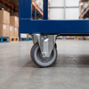80mm fixed castor with grey polyurethane wheel under a blue steel warehouse cart
