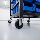 80mm black rubber bolt hole castors on a steel assembly line parts cart with blue bins