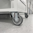 80mm swivel castor with grey polyurethane wheel under a white hospital cart
