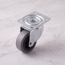 80mm swivel top plate castor grey rubber wheel 100kg, high angle view on grey marble
