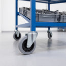 80mm grey rubber bolt hole castors on a blue steel production line parts cart