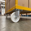 80mm swivel castor with white nylon wheel bolted with nuts under a yellow warehouse cart