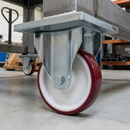 Fixed castor with red polyurethane wheel and zinc top plate