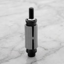 Round expanding tube adaptor 21.7-24.5mm for castors on light grey marble, high-angle three-quarter view