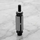 Round expanding tube adaptor 19.5-21.7mm for castors on light grey marble, high-angle three-quarter view
