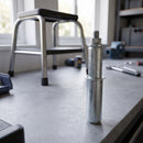 25.4mm round spring fitting castor adaptor on a garage workbench with a step stool behind