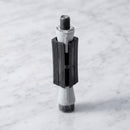 Square expanding tube adaptor 36-38mm for castors on light grey marble, high-angle three-quarter view